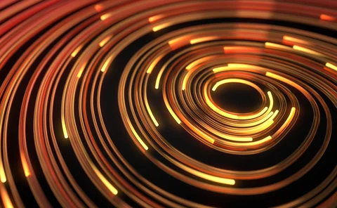 Abstract spiral of glowing orange and yellow light trails on a black background