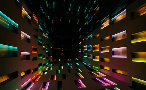 Futuristic abstract interior with colorful neon geometric patterns, creating a modern light display